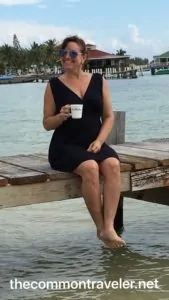 Belize woman on dock in Belize with coffee
