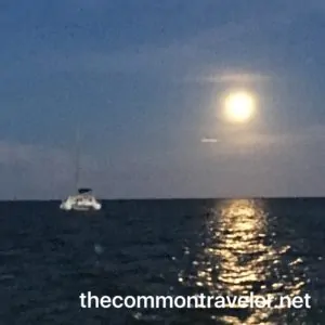 The Best Restaurants in San Pedro Belize featured by top travel blog, The Common Traveler: Moonlight over Belize