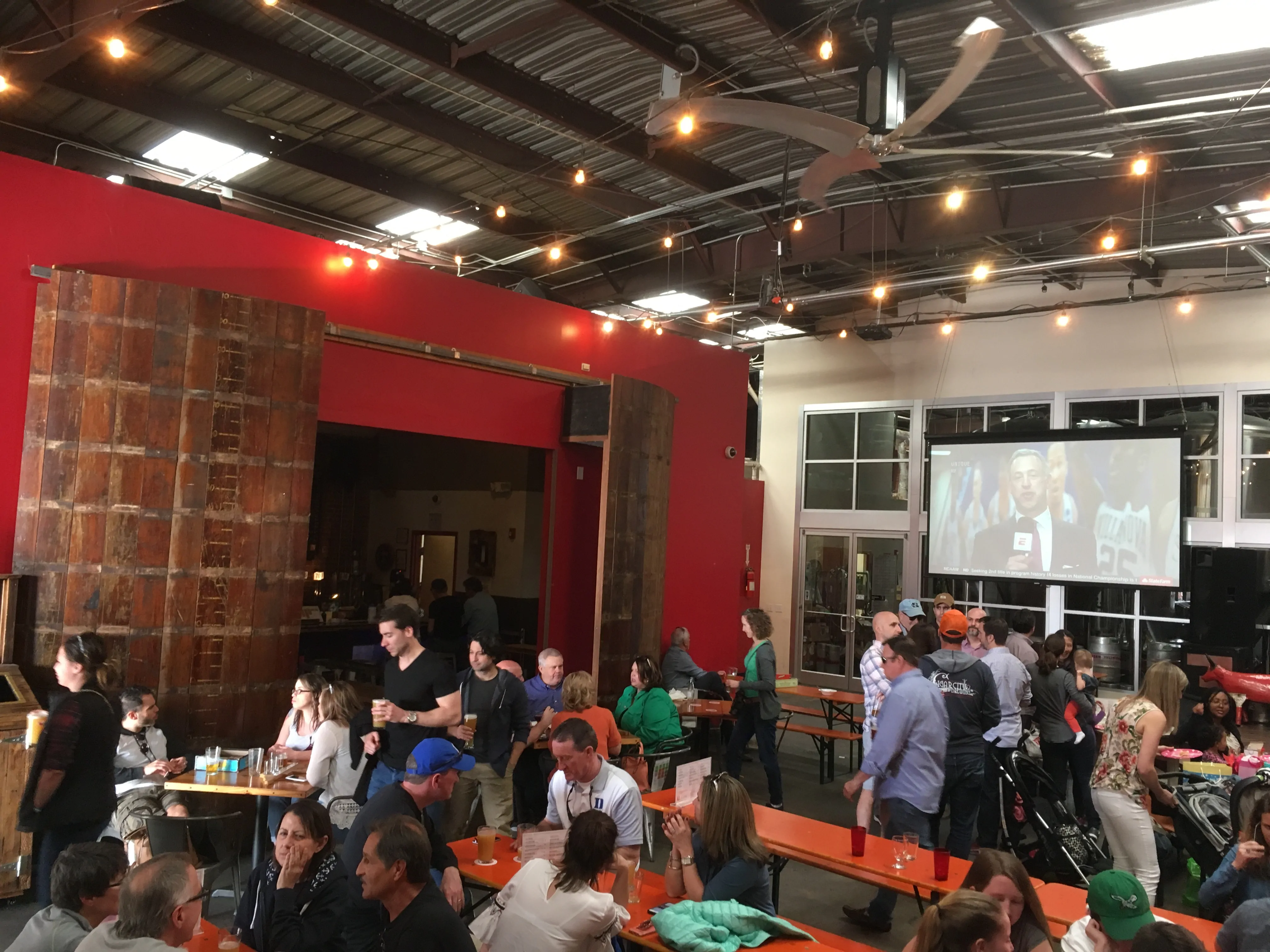 patrons at open barn doors in Fullsteam Brewing