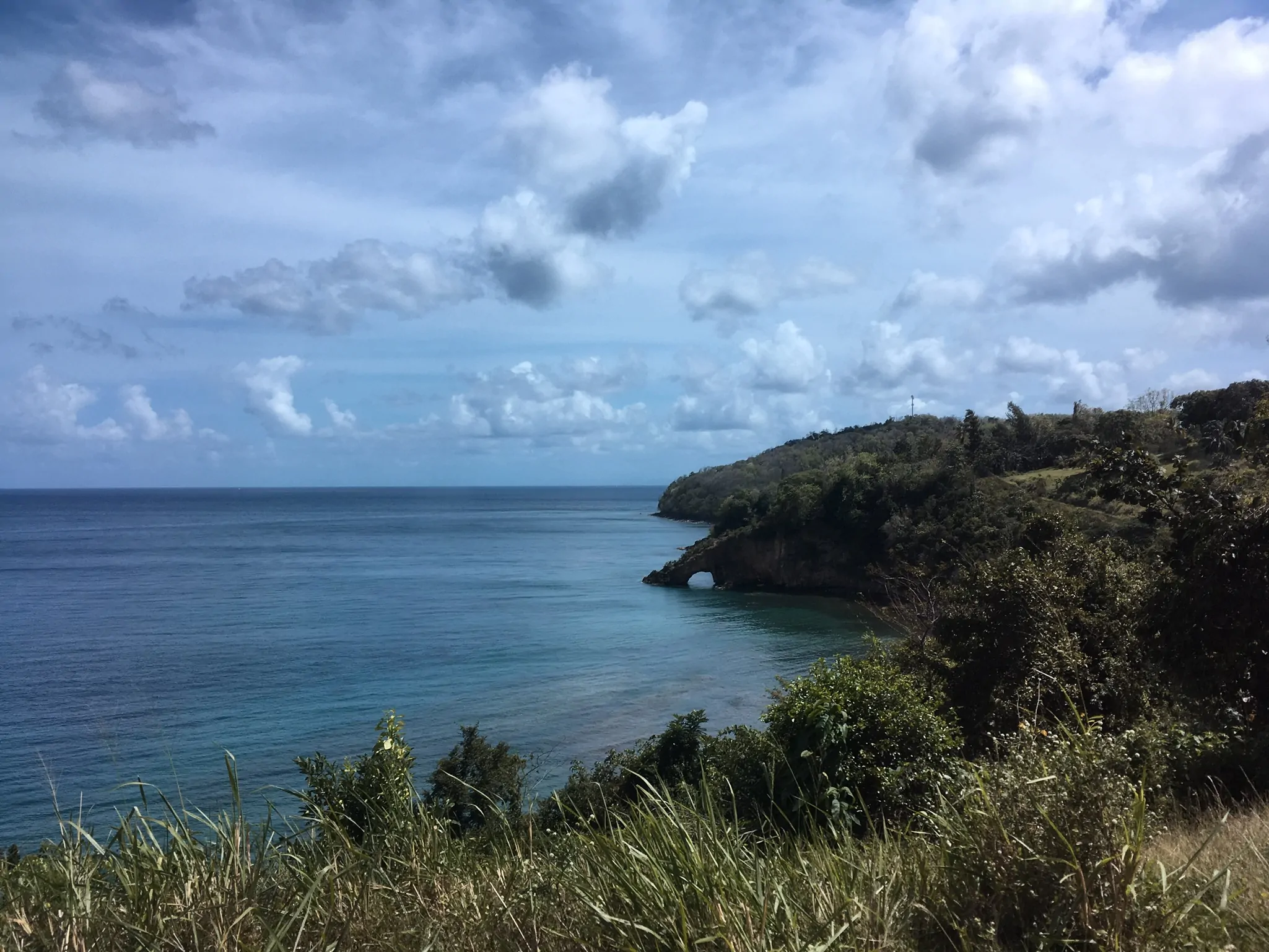 St. Lucia ocean with point jutting out forming a passage