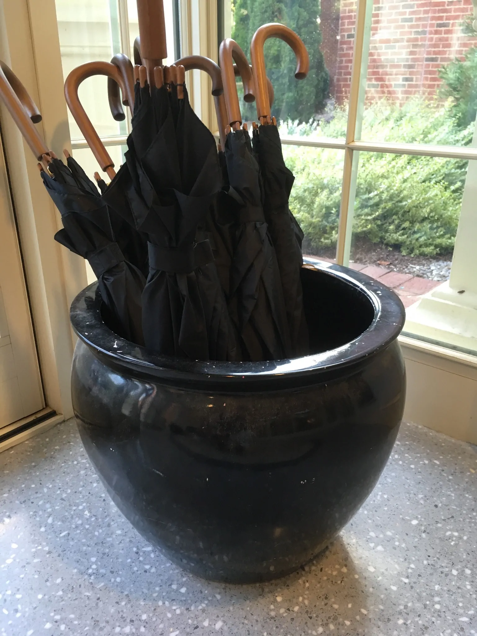 Rizzo Center black umbrellas in stand