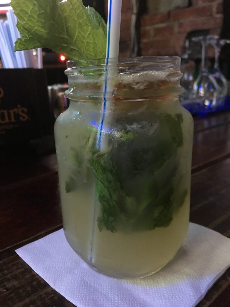 hotel in Old San Juan mason jar with mojito drink (with mint leaves and straw) in Old San Juan, PR