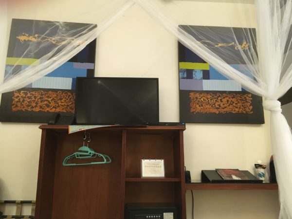 hotel in Old San Juan close with two paintings and netting above, Casablanca Hotel, Old San Juan