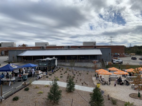 mill building home to Cabarrus Brewing Company with food trucks and beer garden