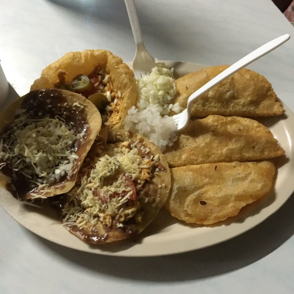The Best Restaurants in San Pedro Belize featured by top travel blog, The Common Traveler; photo of plate at Neri's Tacos