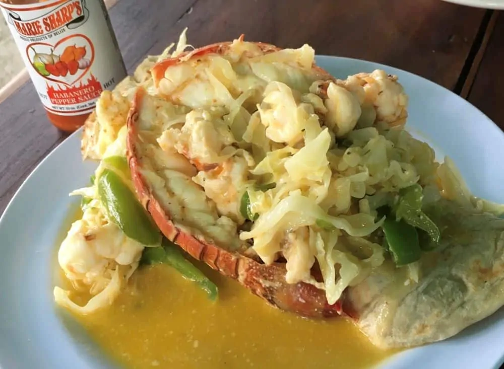 The Best Restaurants in San Pedro Belize featured by top travel blog, The Common Traveler; photo of lobster tail burrito at Waruguma