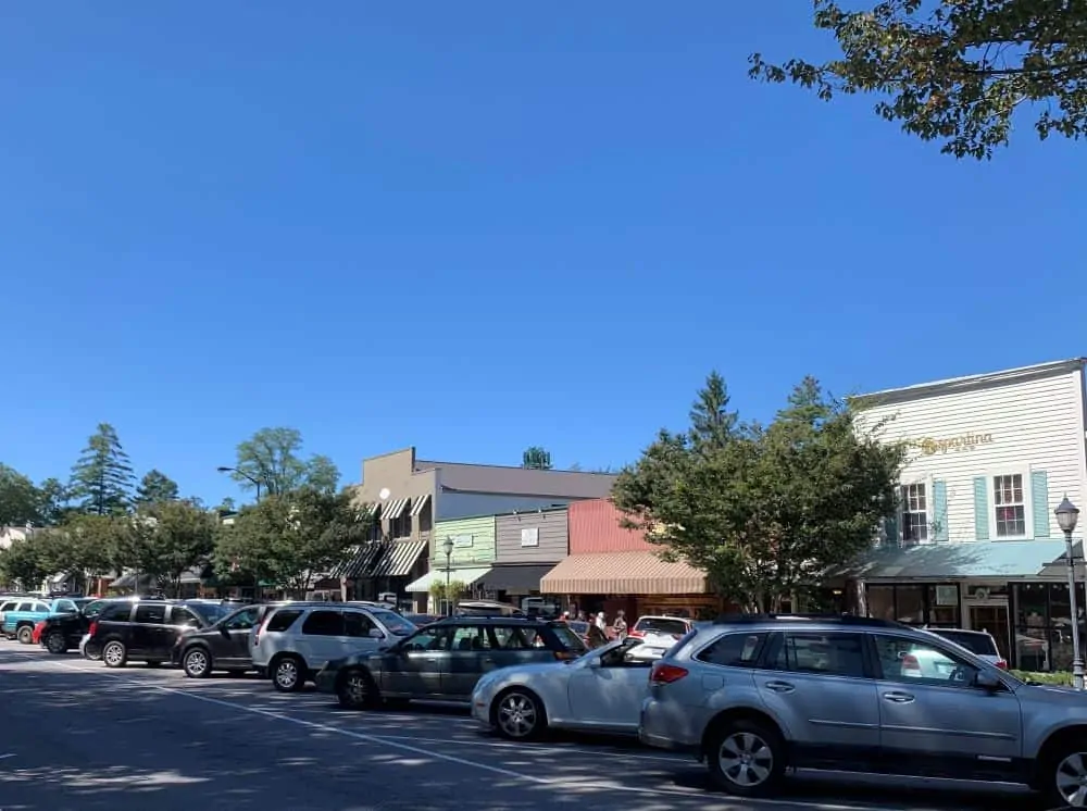 cars and stores along Main Street in Highlands NC