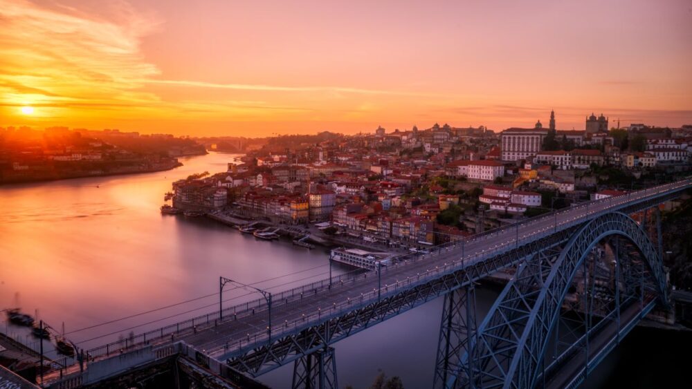 Europe on a Budget | The Common Traveler | image: gray bridge at sunset in Porto, Portugal