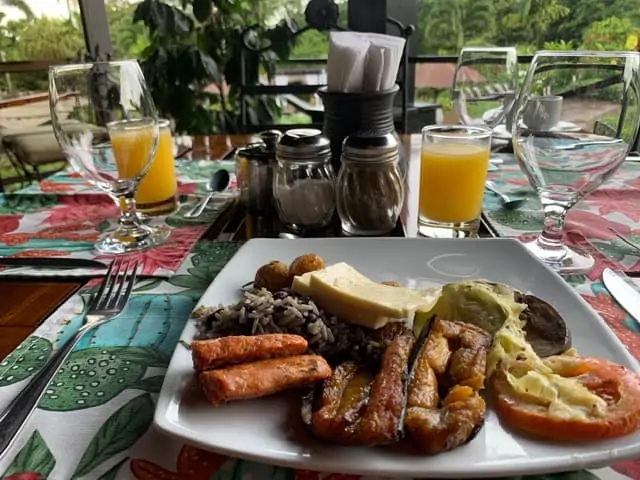 Arenal Springs Resort review featured by top international travel blogger, The Common Traveler | image: plate on table with Costa Rican breakfast items
