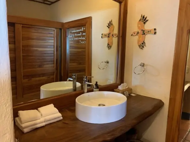 Hotel Punta Islita | The Common Traveler | image: white sink on wooden table top | Hotel Punta Islita by popular US international travel blog: image of a bathroom at Hotel Punta Islita.