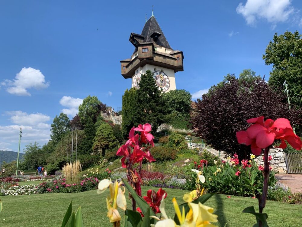 2 WEEK CENTRAL EUROPE ITINERARY featured by top travel blogger, The Common Traveler | image: clock tower in Graz, Austria