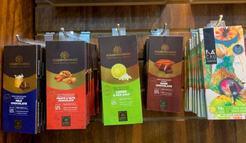 TOP 10 BEST SOUVENIRS FROM ECUADOR featured by top travel blogger, The Common Traveler | image: various chocolate bars hanging