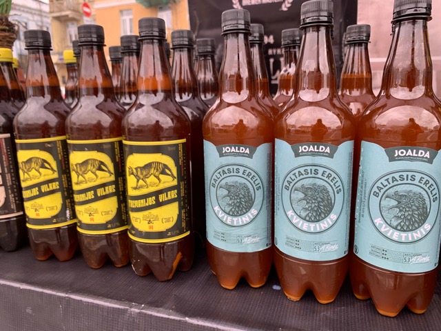 20 Lithuanian Food and Drinks to Try featured by The Common Traveler | image: bottles of beer
