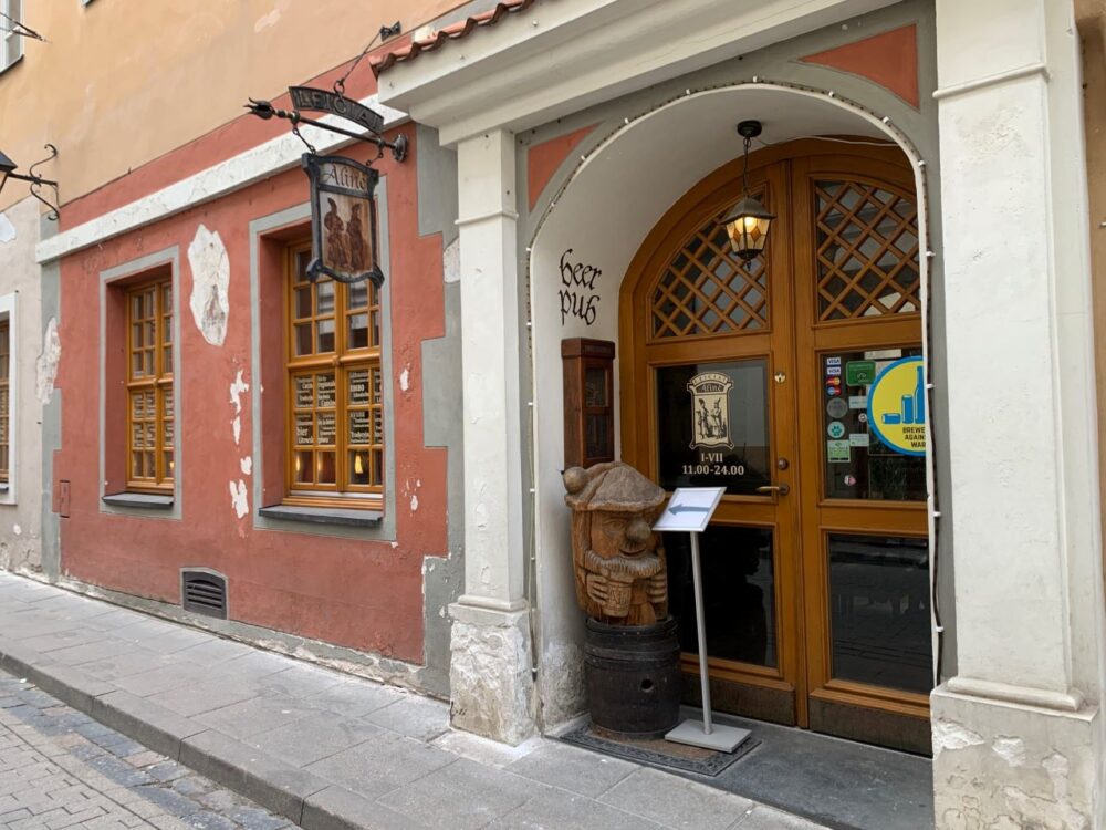 20 Lithuanian Food and Drinks to Try featured by The Common Traveler | image front of Aline Leiciai pub