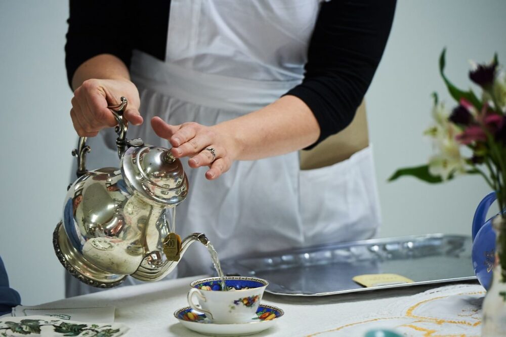 Afternoon Tea in Salisbury MD at the gillis grier bed and breakfast by The common Traveler | image: afternoon tea being poured from silver container