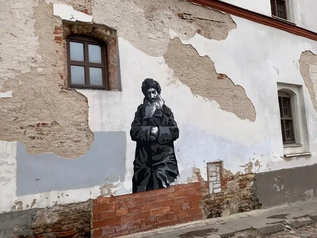 mural of old Jewish man on wall in Vilnius, Lithuania