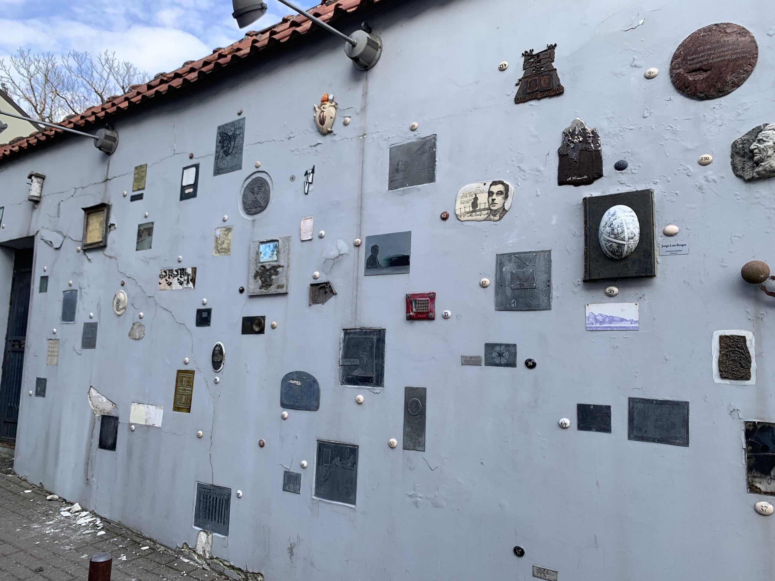 while wall with poetry art in Vilnius, Lithuania