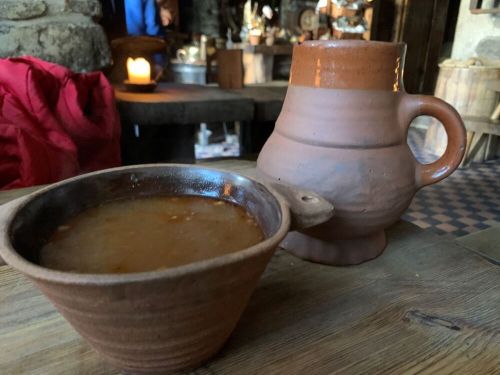 Best Things to do in Tallinn | The Common Traveler | image: bowl of deer soup and mug of beer