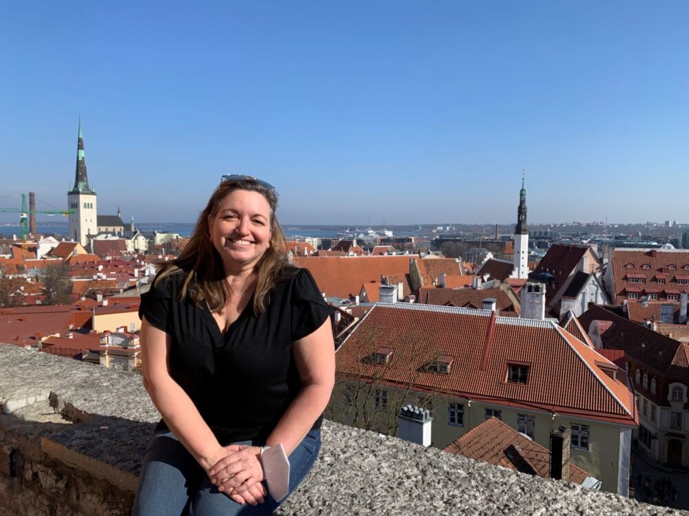 Best Things to do in Tallinn | The Common Traveler | image: woman on Kohtuotsa Viewing Platform with Tallinn in background
