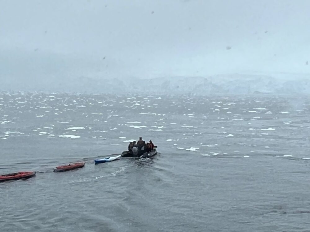 What to Pack for an Antarctica Cruise | The Common Traveler | image: zodiac taking out kayaks for passengers in Antarctica