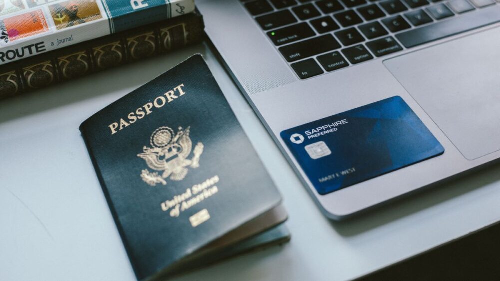 The Common Traveler | How Your Credit Affects Your Travel | image: Passport and credit card on laptop