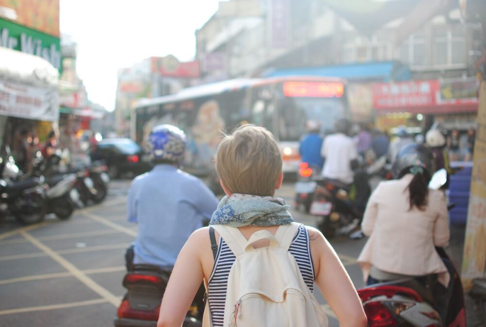 The Common Traveler | How Your Credit Affects Your Travel | image: back of woman traveling