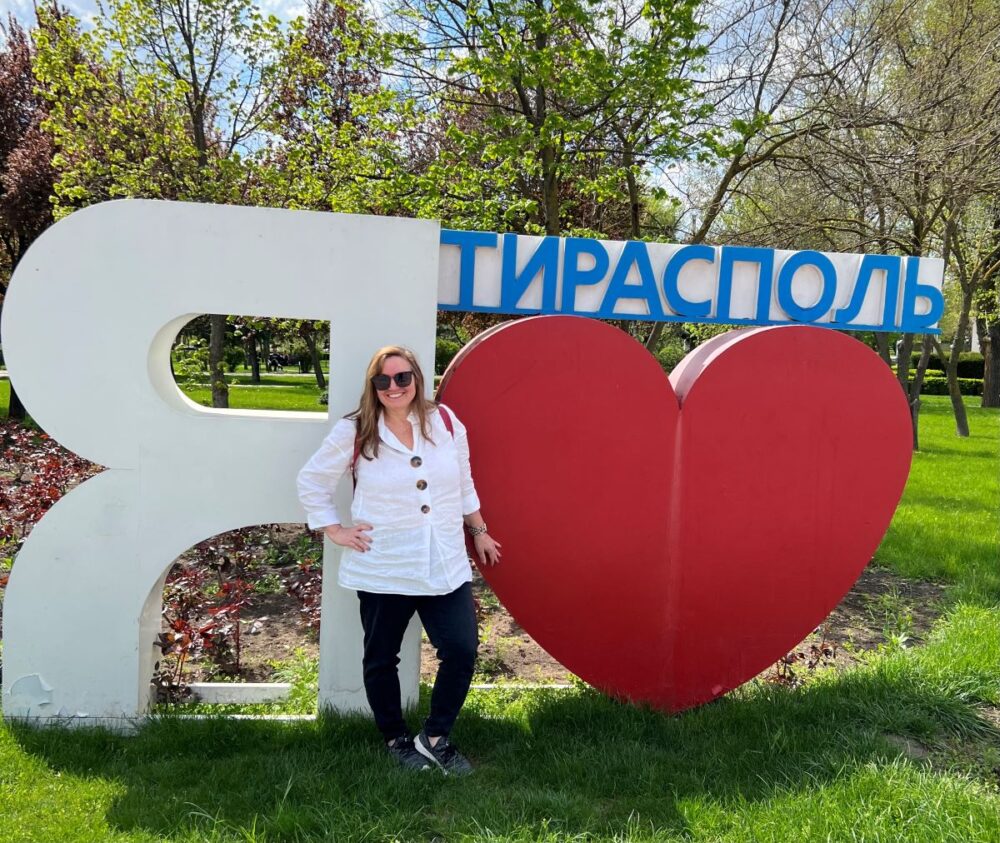 Is Transnistria Worth Visiting? | The Common Traveler | image: woman in front of "I Love Tiraspol" sign