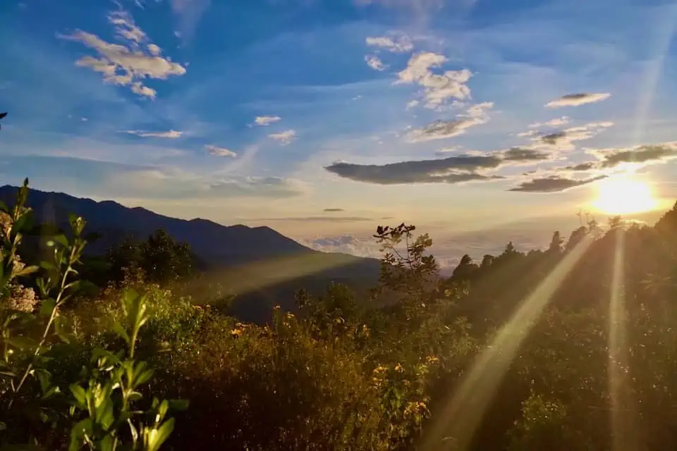 Things to Do in Oaxaca Mexico | The Common Traveler | image: sun setting over mountains in San Jose del Pacifico