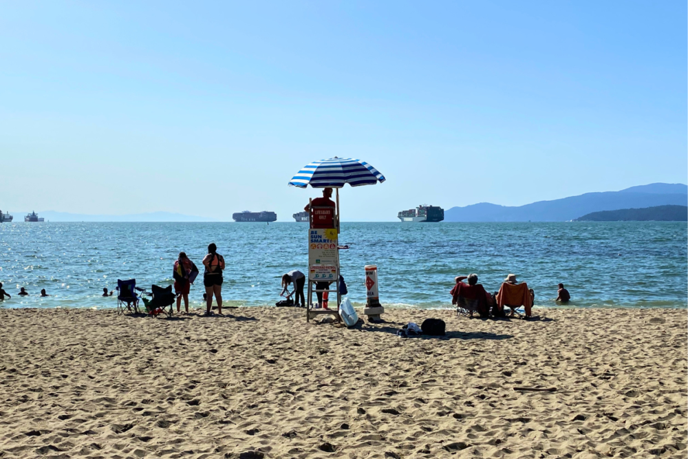 21 Best Things to Do in Vancouver | The Common Traveler | image: lifeguard chair on beach with ships in background