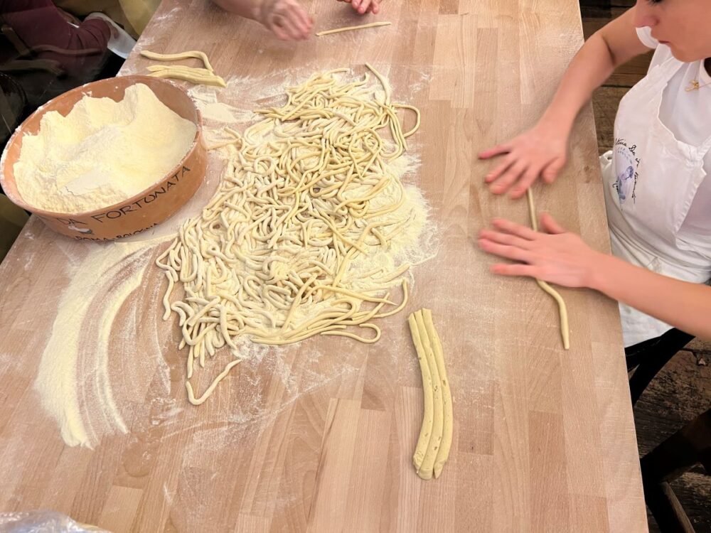 16 Best Things to Do in Rome for First-Time Visitors | The Common Traveler | image: women hand-rolling pasta
