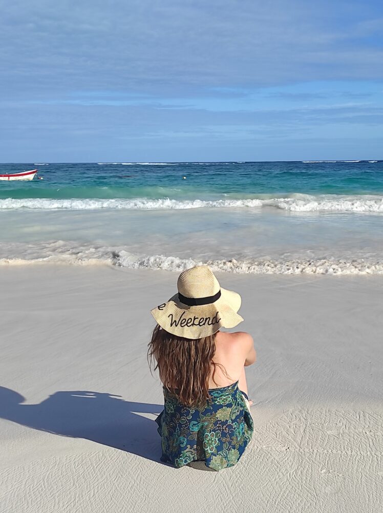 Complete Guide to Tulum on a Budget | The Common Traveler | image: woman on beach in Tulum