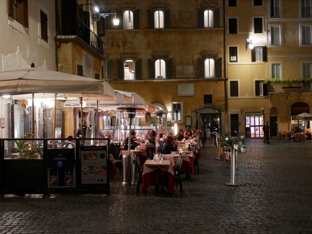 16 Best Things to Do in Rome for First-Time Visitors | The Common Traveler | image: eateries at night in Trastevere