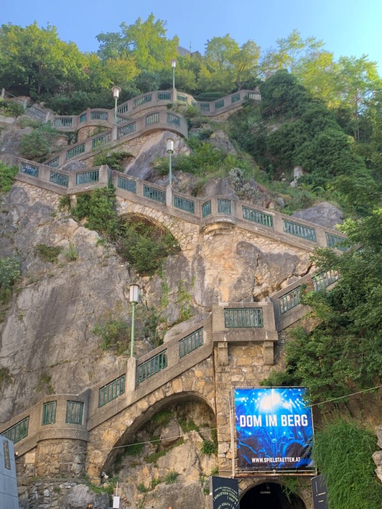 Best Things to Do in Graz | The Common Traveler | image: stairs in hill leading up to clock tower
