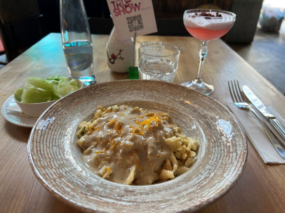 Hungarian Foods and Drinks to Try | The Common Traveler | image: plate of dumplings with pink drink