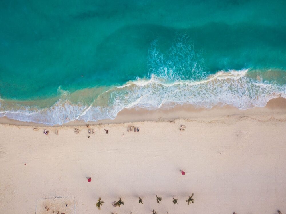 Cabo vs Cancun: Where Should You Go? | The Common Traveler | image: view from above of Cancun beach