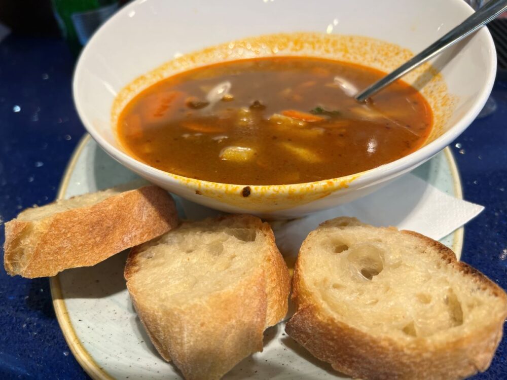 Hungarian Foods and Drinks to Try | The Common Traveler | image: bowl of goulash with sliced bread