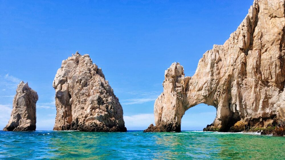 Cabo vs Cancun: Where Should You Go? | The Common Traveler | image: rocky islands in Cabo