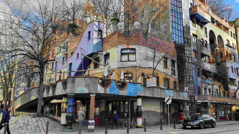 20 Best Tips for Visiting Vienna | The Common Traveler | image: Hundertwasserhaus building with trees growing on it