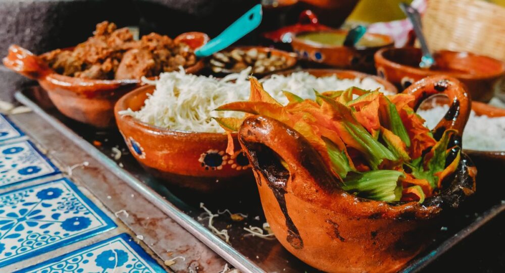 Cabo vs Cancun: Where Should You Go? | The Common Traveler | image: tray with Mexican foods