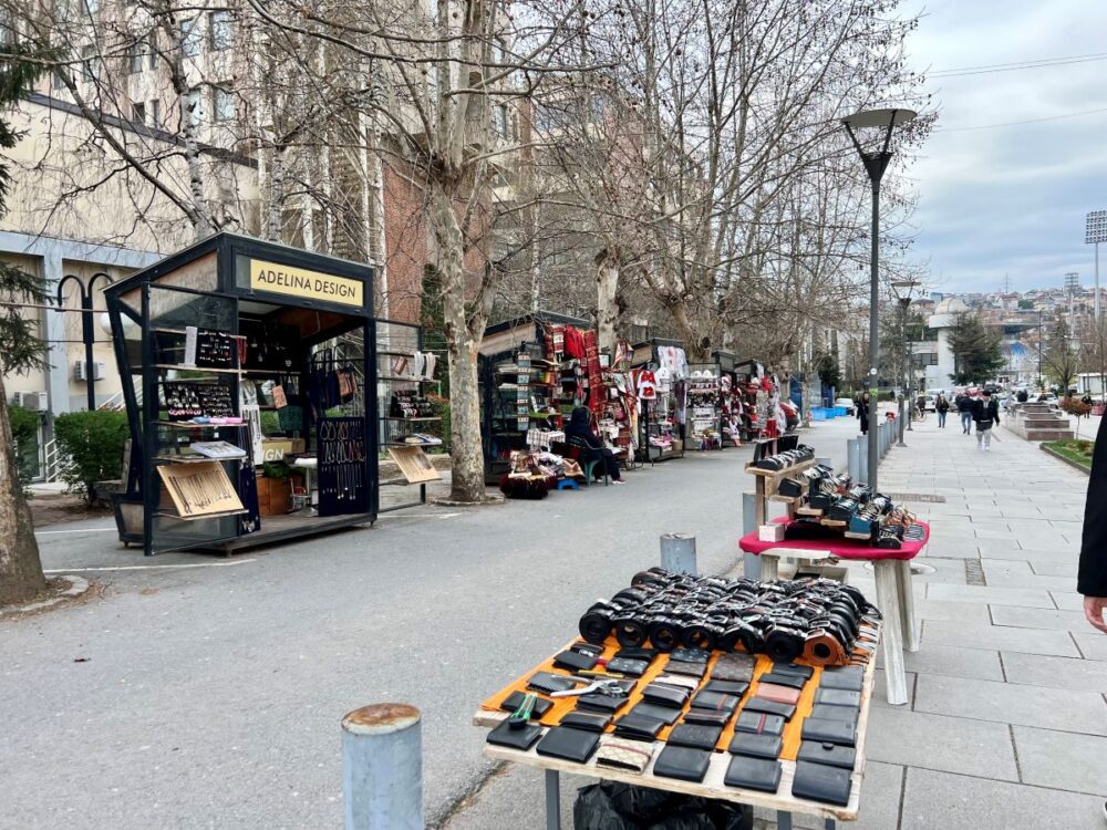 Pristina Itinerary | The Common Traveler | image: street lined with shops