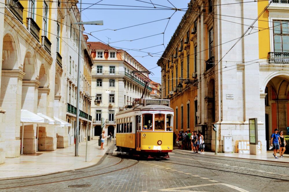 Europe on a Budget | The Common Traveler | image: yellow tram in Lisbon, Portugal