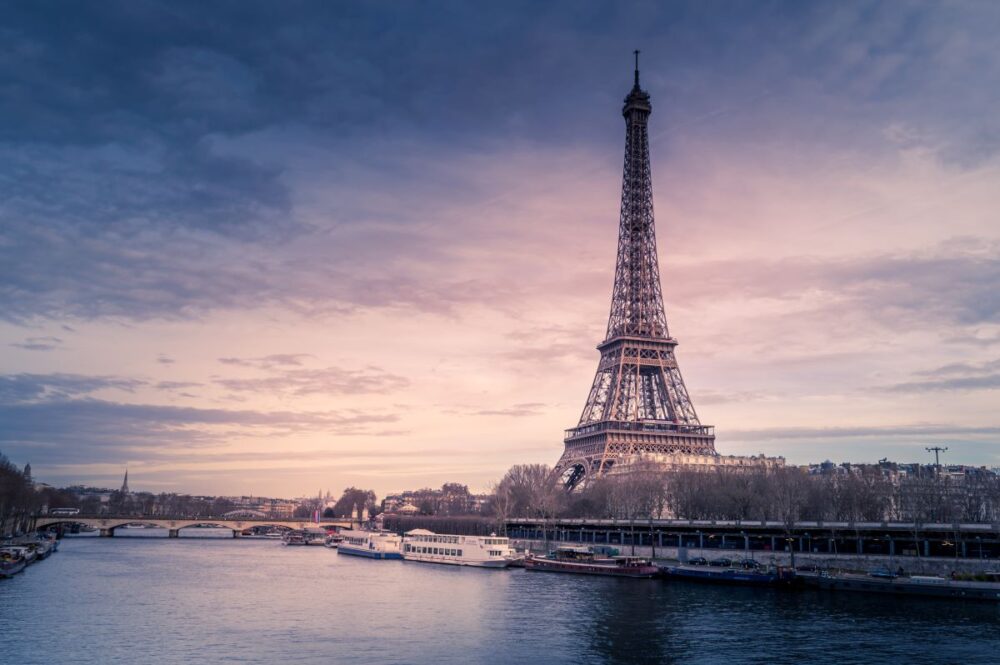 15 Famous Places in Europe | The Common Traveler | image: Eiffel tower with Seine in forefront