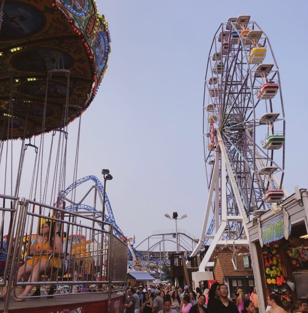 11 Best Things to Do in Ocean City NJ | The Common Traveler | image: ferris wheel, swings, and roller coaster