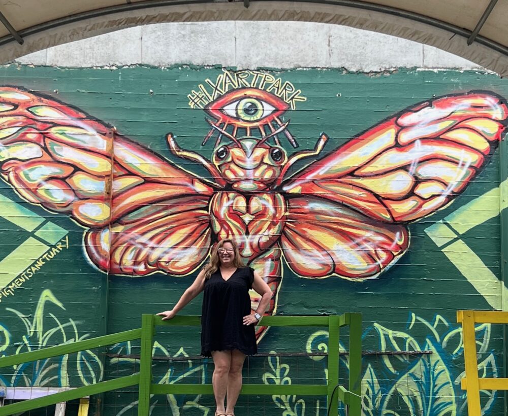 15+ Amazing Things to Do in Charlottesville, Virginia | The Common Traveler | image: woman in front of butterfly mural