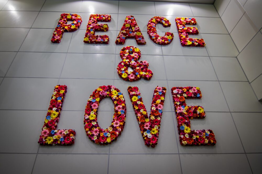 Best Airport for Bonita Springs FL | The Common Traveler | image: Peace & Love sign at Miami International Airport