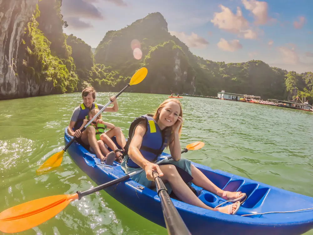 Incredible Things to Do in Halong Bay | The Common Traveler | image: kayakers on Halong Bay