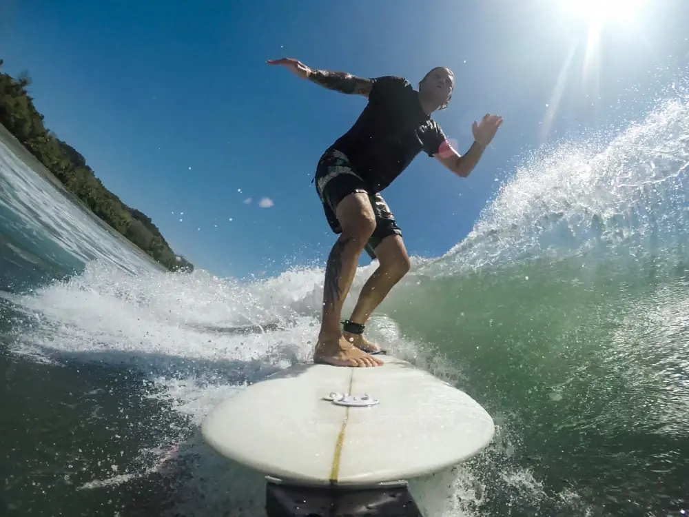 Things to Do in Jaco | The Common Traveler | image: surfer on wave