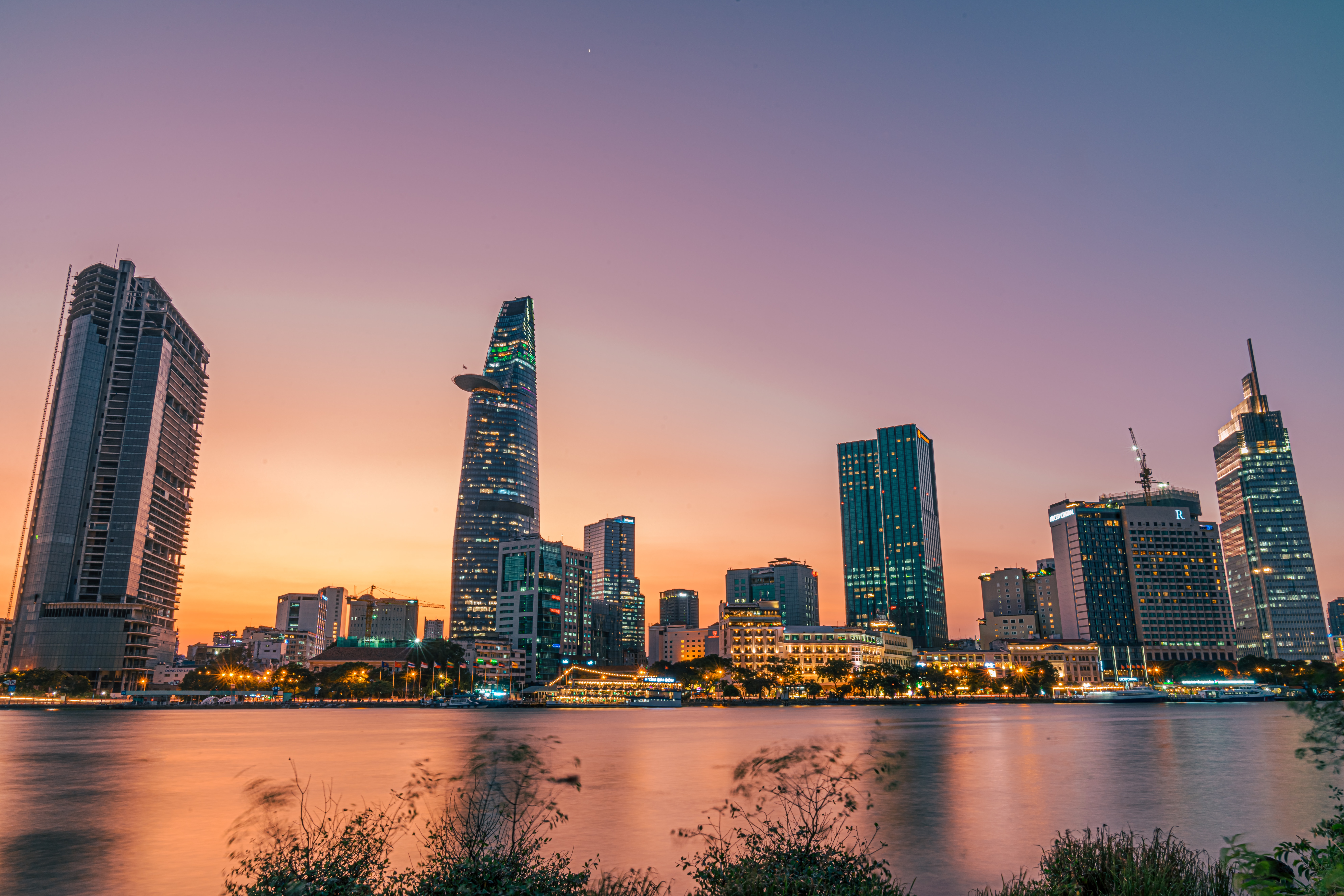 Self-Guided Walking Tour of Ho Chi Minh | The Common Traveler | image:  Ho Chi Minh skyline at sunset