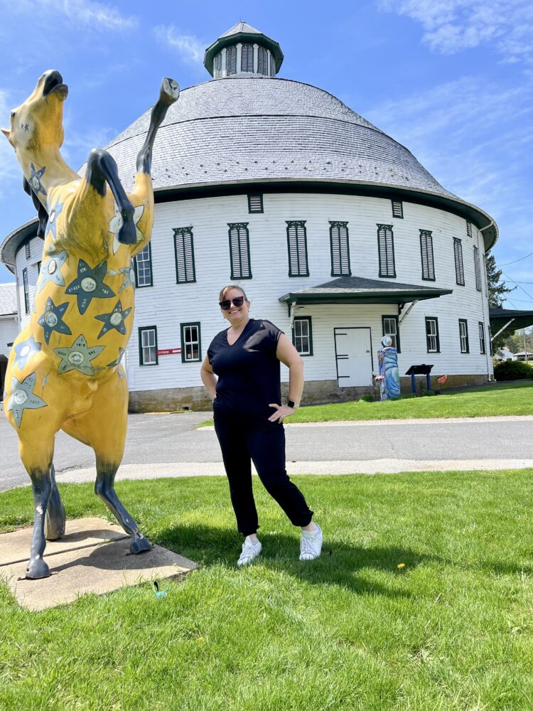 Insta-Worthy Photo Spots in Gettysburg and Adams County | The Common Traveler | image: woman with horse statue at Historic Round Barn
