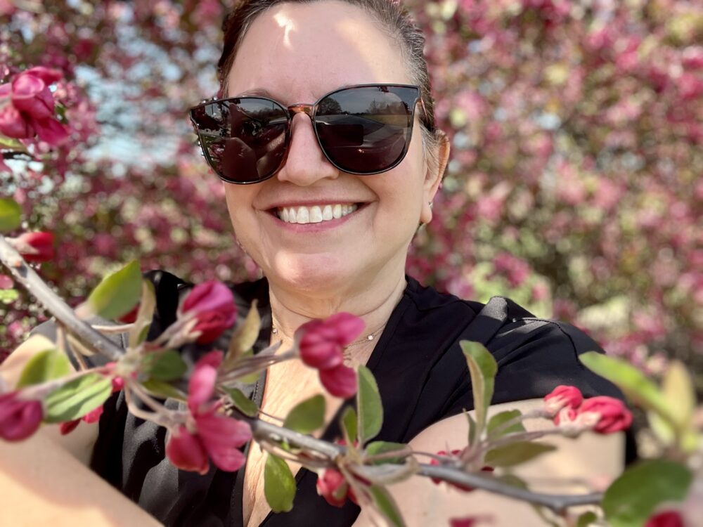Hidden Gems in Gettysburg and Adams County | The Common Traveler | image: woman standing among flowering trees